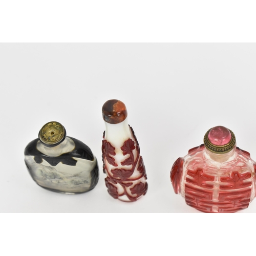 27 - A collection of Chinese glass and agate scent bottles, late 19th/20th century, to include two carved... 