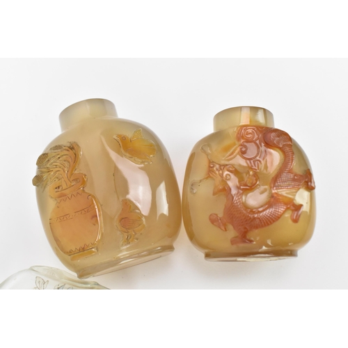 27 - A collection of Chinese glass and agate scent bottles, late 19th/20th century, to include two carved... 