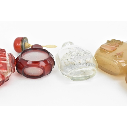 27 - A collection of Chinese glass and agate scent bottles, late 19th/20th century, to include two carved... 