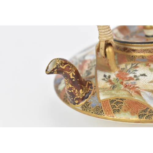 36 - A Japanese Satsuma porcelain teapot by Ryuzan 龍山, Meiji period, finely decorated with fan shaped fig... 