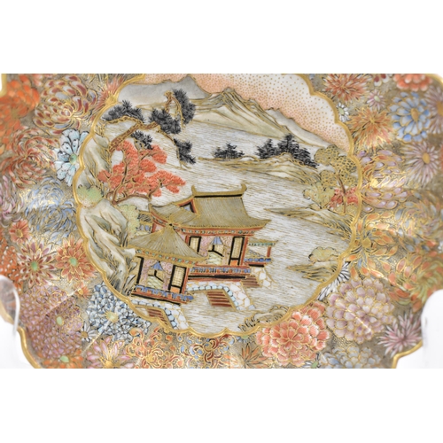 41 - A Japanese Satsuma porcelain decorative saucer by Yozan, Meiji period, with petal rim, decorated wit... 