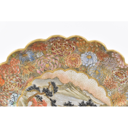 41 - A Japanese Satsuma porcelain decorative saucer by Yozan, Meiji period, with petal rim, decorated wit... 