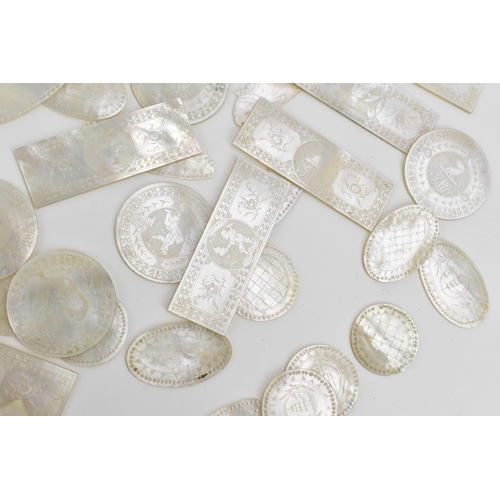 56 - A collection of Chinese export mother of pearl game counters, of various sizes and shapes, each engr... 