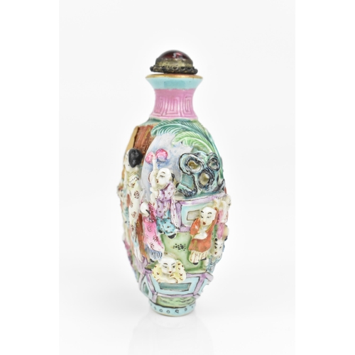 59 - A Chinese molded Famille Rose porcelain snuff bottle, mid/late 19th century, Jingdezhen kilns, molde... 