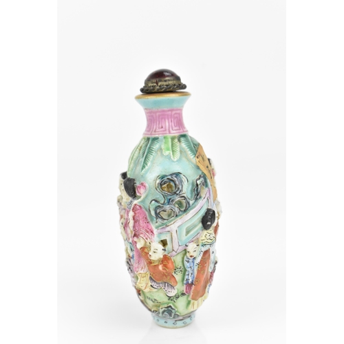 59 - A Chinese molded Famille Rose porcelain snuff bottle, mid/late 19th century, Jingdezhen kilns, molde... 