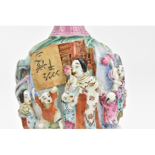 59 - A Chinese molded Famille Rose porcelain snuff bottle, mid/late 19th century, Jingdezhen kilns, molde... 