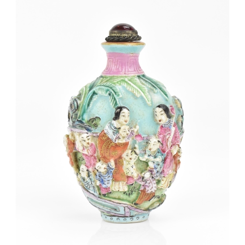 59 - A Chinese molded Famille Rose porcelain snuff bottle, mid/late 19th century, Jingdezhen kilns, molde... 