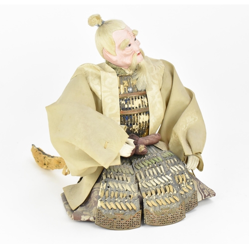 65 - A Japanese Musha-Ningyo (Boys Day doll) of a Samurai, Edo period, early 19th century, the warrior in... 