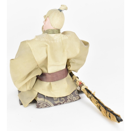 65 - A Japanese Musha-Ningyo (Boys Day doll) of a Samurai, Edo period, early 19th century, the warrior in... 