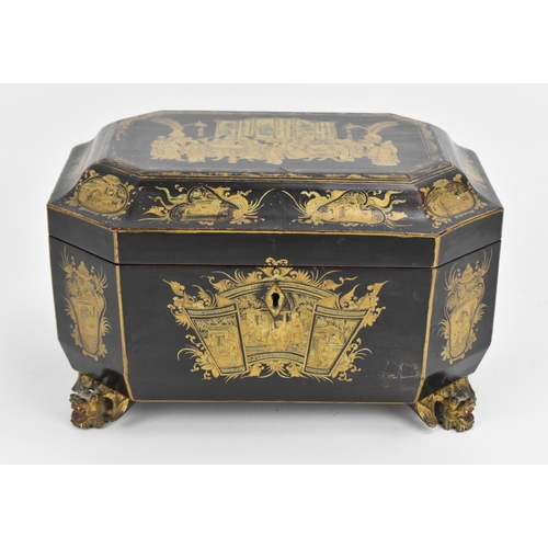 71 - A 19th century Chinese black lacquered tea caddy, of sarcophagus form, with gilt chinoiserie decorat... 