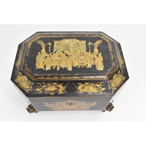 71 - A 19th century Chinese black lacquered tea caddy, of sarcophagus form, with gilt chinoiserie decorat... 