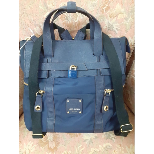 Henri Bendel New York A navy canvas and leather Jetsetter bag with detachable backpack straps havi