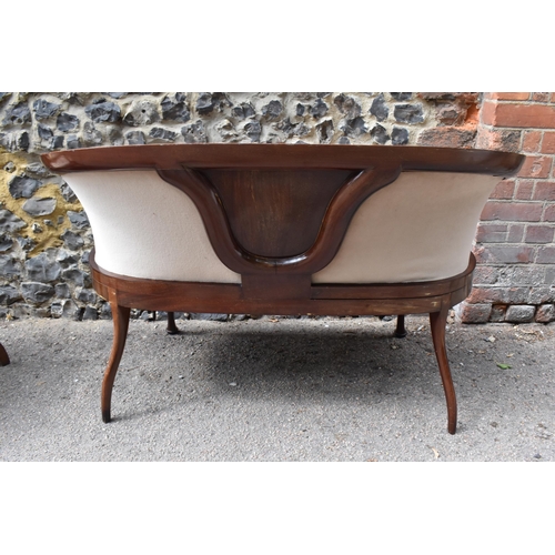 137 - An Edwardian rosewood, mahogany and bone inlaid salon suite, comprising a two seater sofa, an armcha... 