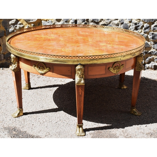 139 - A French Empire style ormolu-mounted round coffee table, 20th century, in the Egyptian revival taste... 