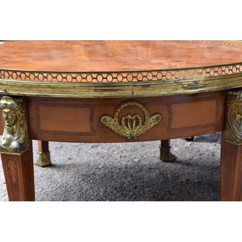 139 - A French Empire style ormolu-mounted round coffee table, 20th century, in the Egyptian revival taste... 