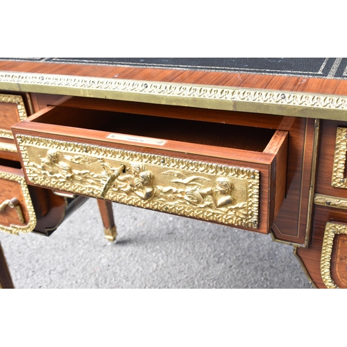 140 - A French ormolu-mounted kingwood parquetry desk, 20th century, inspired by the 19th century French c... 