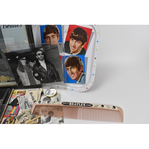 191 - A collection of 'The Beatles' ephemera, to include a 1960's oversized novelty comb by Lido Toys, a W... 