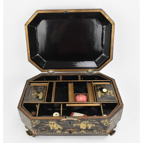 55 - A Chinese black lacquer workbox / sewing box, 19th century, of octagonal form, the lid with central ... 