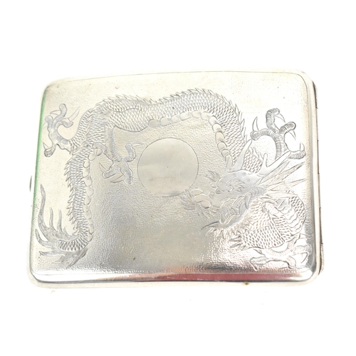 74 - A Chinese export white metal cigarette card case, early 20th century, designed with dragons chasing ... 