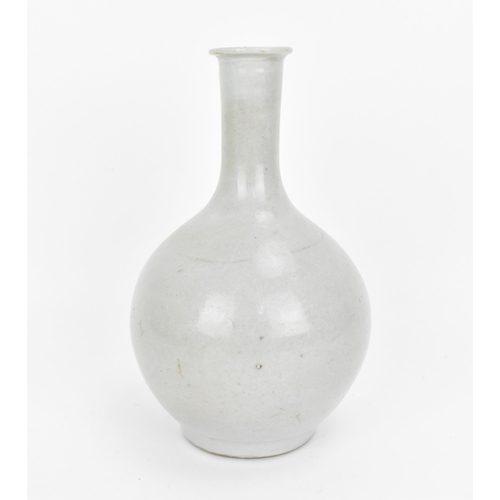 76 - A Chinese qingbai glazed bottle vase, in the Song style, with everted lip, of plain glaze, 21 cm hig... 