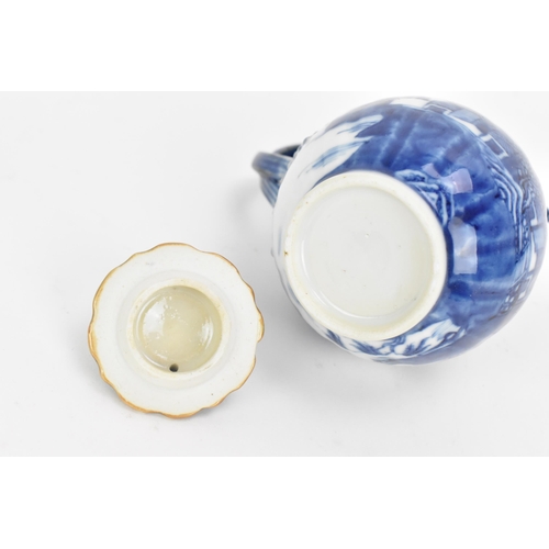 77 - A Chinese blue and white Nanking porcelain trio of teapot, cup and saucer, 18th century, the small t... 