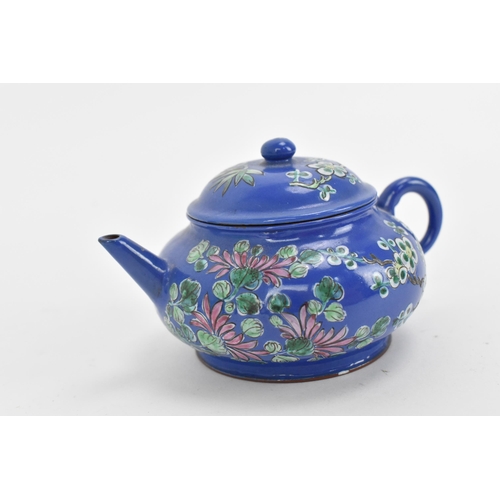 80 - A Chinese enamelled Yixing (zisha) miniature teapot, 20th century, of squat form with blue ground de... 