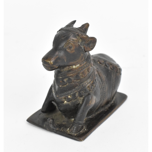 87 - A patinated bronze figure of Nandi bull, South India, 19th century or earlier, the vahana of Siva in... 