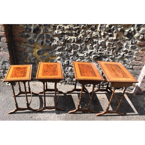 144 - A Victorian quartetto nest of mahogany, satinwood and rosewood tables, with ebony beading, the top o... 