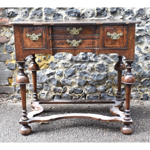 201 - A William and Mary style walnut dressing table, early 18th century, with feather-banded rectangular ... 