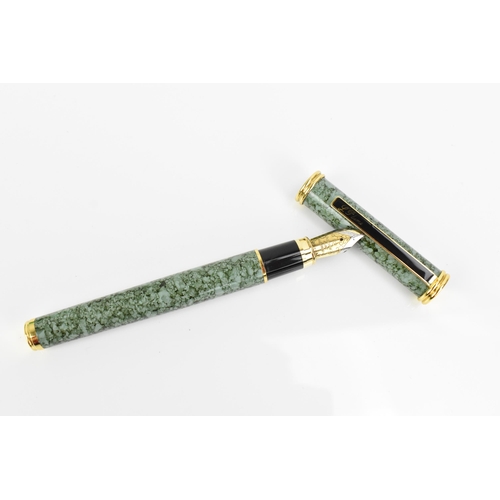 70 - A collection of pens, comprising a L'Plume piston fill fountain pen, in green mottled enamel finish ... 