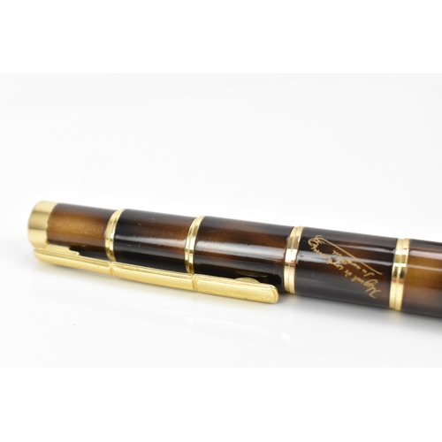 A Montblanc Miguel de Cervantes writers series ballpoint pen with brown marbled lacquer body and go