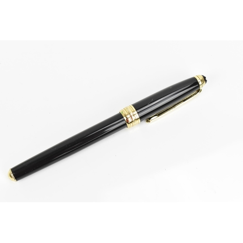 72 - A Montblanc Meisterstuck Pix rollerball pen, in black lacquer and gilt, the tip of the cap with engr... 