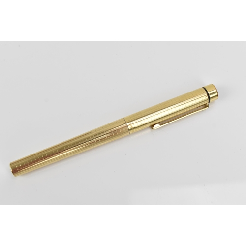 73 - A Sheaffer gold-plated fountain pen, with 14ct yellow gold nib, stamped 585, of tapered form with pa... 