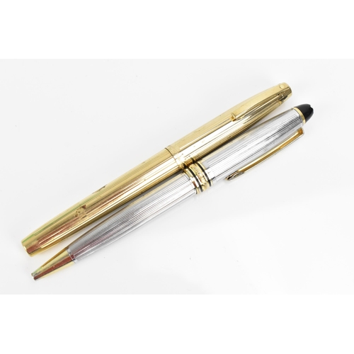 74 - A Sheaffer gold-plated fountain pen, with 14ct yellow gold nib, stamped 585, of tapered form with pa... 