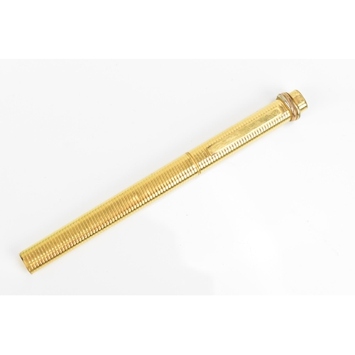 75 - A Must de Cartier gold plated ballpoint pen with push button to lid bringing the clip out
Location: ... 