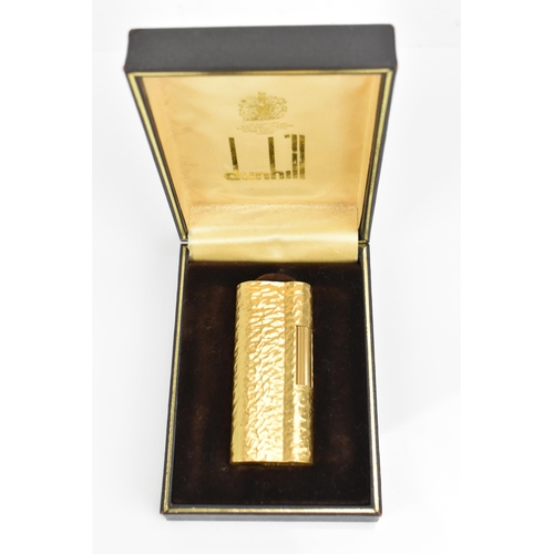 77 - A gilt Dunhill lighter with bark effect, in original box
Location: CAB6