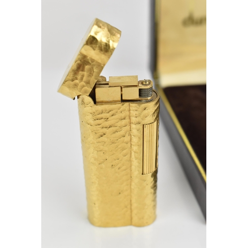 77 - A gilt Dunhill lighter with bark effect, in original box
Location: CAB6