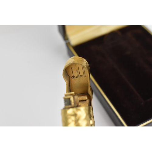 77 - A gilt Dunhill lighter with bark effect, in original box
Location: CAB6