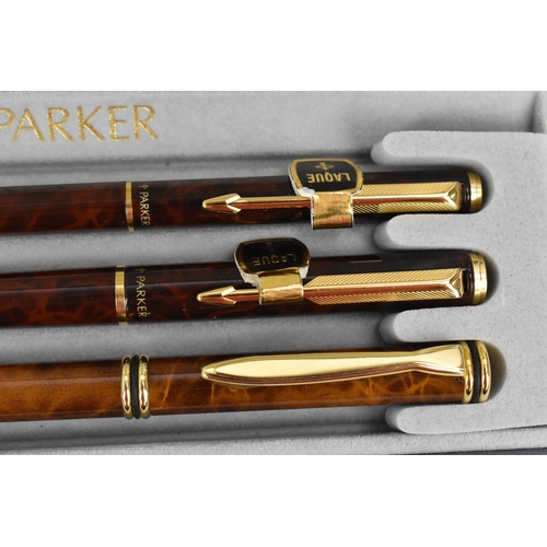 83 - A cased set of Chinese lacquer Parker pens, comprising two fountain and one ballpoint pen, each with... 