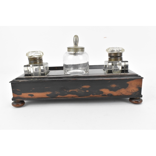 86 - A mid-century coromandel double inkstand, with two cut glass inkwells either side of an ink pot, wit... 