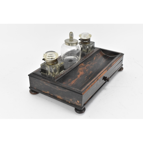 86 - A mid-century coromandel double inkstand, with two cut glass inkwells either side of an ink pot, wit... 