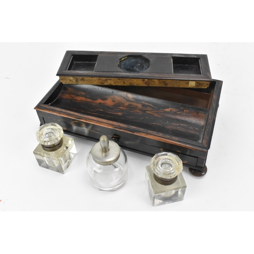 86 - A mid-century coromandel double inkstand, with two cut glass inkwells either side of an ink pot, wit... 