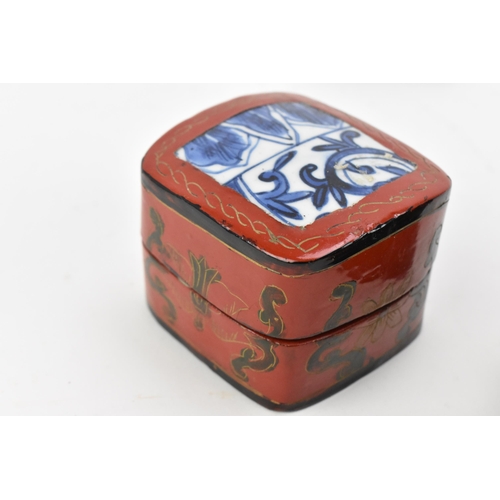 100 - Two Oriental lacquer boxes, each mounted with Chinese blue and white porcelain pieces to the lids, t... 