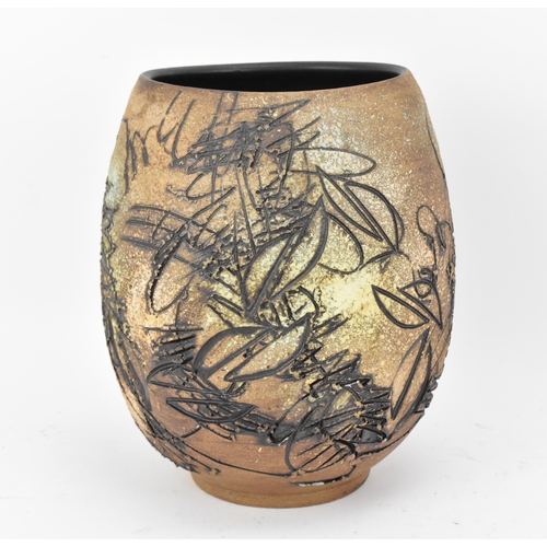 103 - A Japanese sgraffito stoneware vase, of ovoid form with deep sgraffito striations, shapes and curves... 