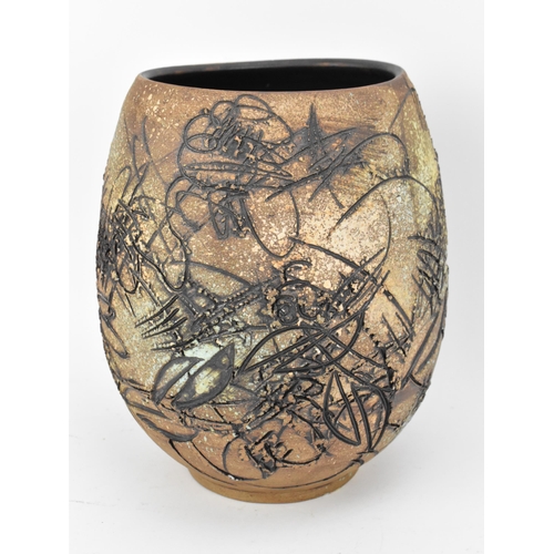 103 - A Japanese sgraffito stoneware vase, of ovoid form with deep sgraffito striations, shapes and curves... 