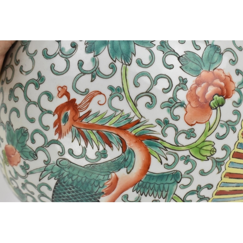 104 - A pair of Chinese Famille Verte porcelain ginger jars, early 20th century, of ovoid form with dragon... 