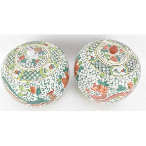 104 - A pair of Chinese Famille Verte porcelain ginger jars, early 20th century, of ovoid form with dragon... 