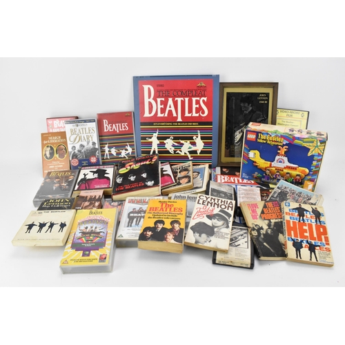 190 - A collection of 'The Beatles' collector's ephemera, to include various books, tapes, VHS, calendars,... 