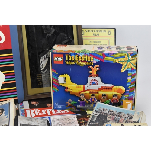 190 - A collection of 'The Beatles' collector's ephemera, to include various books, tapes, VHS, calendars,... 