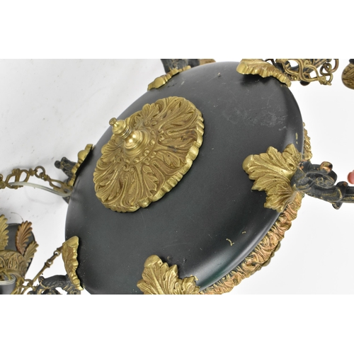 208 - An Empire style toleware and gilt-metal chandelier, of plain design holding six arms with sleeves, h... 